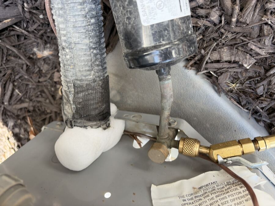 Frost building up on a refrigerant line and filter drier